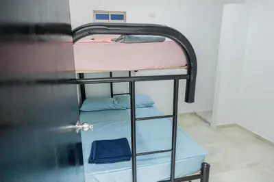 a couple of bunk beds in a room at Apartamentos King Arthur in Punta Seca
