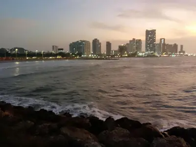 a view of the city from the beach at night at shanty guest hostal in Cartagena de Indias