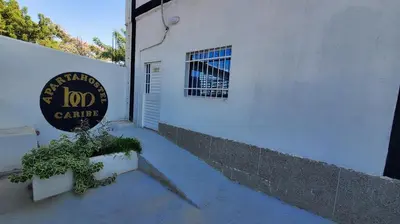 a sign for a zoo center next to a building at Suite hm caribe in Santa Marta