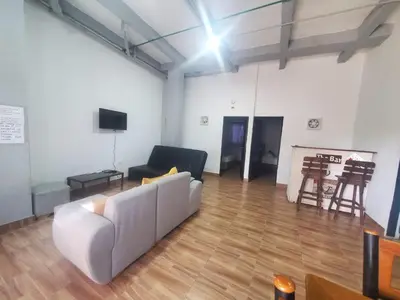 a living room with a couch and a fireplace at Suite hm caribe in Santa Marta