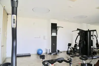 a gym with bikes and exercise equipment in a room at Apartamento en Riomar in Barranquilla