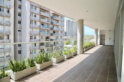 a balcony of an apartment building with plants at Apartamento en Riomar in Barranquilla