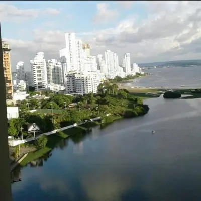 an aerial view of a city with a river and buildings at Apartamento Tres Carabelas El Laguito in Cartagena de Indias