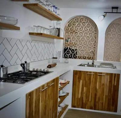 a kitchen with a stove and a sink at Villa frente el mar cartagena de indias in Cartagena de Indias