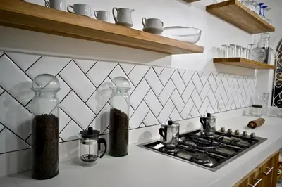 a kitchen counter with two glass containers on a stove at Villa frente el mar cartagena de indias in Cartagena de Indias