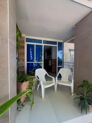 a balcony with two chairs and a table at Apartamento frente al mar orilla beach house in Playa Punta Arena