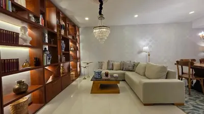 a living room with a couch and a table at Hotel Casa La Tablada Aeropuerto in Cartagena de Indias
