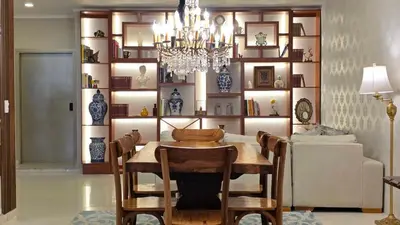 a dining room with a table and a chandelier at Hotel Casa La Tablada Aeropuerto in Cartagena de Indias
