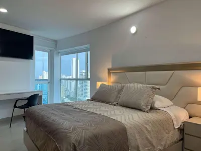 a bedroom with a bed with a view of a city at New apartment with a beautiful view 2002 in Cartagena de Indias