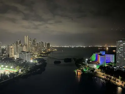 a city skyline at night with a river and buildings at New apartment with a beautiful view 2002 in Cartagena de Indias