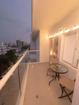 a balcony with a table and chairs and a view at Stunning Caribbean-Inspired PH next to Viva Mall in Barranquilla