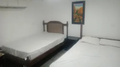 two beds sitting next to each other in a room at cabaña frente al mar de cartagena in Cartagena de Indias