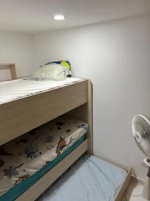 a bedroom with a bunk bed with a fan at Apartamento en Zona Estratégica de Barranquilla in Barranquilla