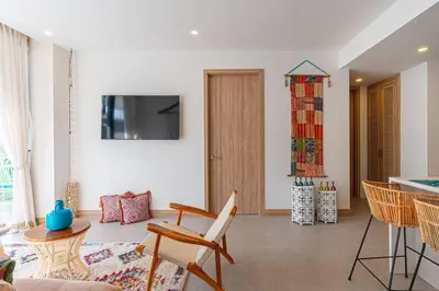 a living room with a table and chairs at Bohemian 2BR - Morros Kai - Private pool & parking in Cartagena de Indias