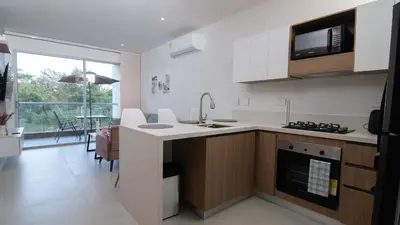 a kitchen with a sink and a counter top at Exclusive New 1-BR Apartment in Baia Kristal Kabo in Los Arrayanes