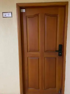 a wooden door with a sign that reads exit at Altamar suite Cabrero in Cartagena de Indias