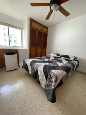 a bedroom with a bed and a ceiling fan at Altamar suite Cabrero in Cartagena de Indias