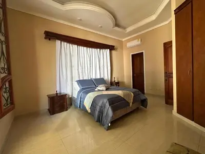 a bedroom with a bed and a window at Casa Rey Colonial 1910 Manga - 7 Habitaciones in Cartagena de Indias