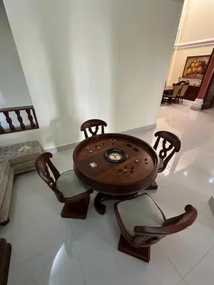 a wooden table and chairs in a room at Casa Rey Colonial 1910 Manga - 7 Habitaciones in Cartagena de Indias