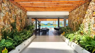 a room with plants in the middle of a building at Baia Kristal Cartagena in Cartagena de Indias
