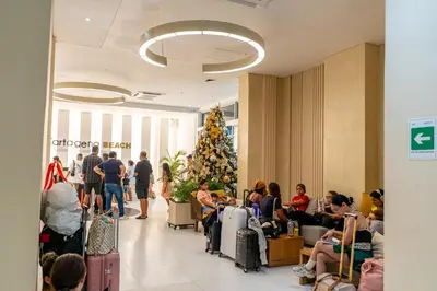 a group of people in a store with a christmas tree at Magica Cartagena Suite in Cartagena de Indias