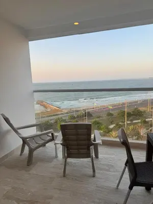a room with chairs and a view of the ocean at Relax vista al mar Aparta suite in Cartagena de Indias