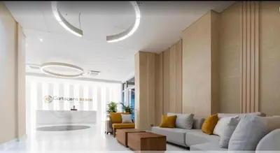a living room with a couch and a table at Relax vista al mar Aparta suite in Cartagena de Indias