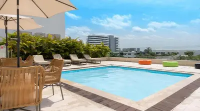 a swimming pool on the roof of a building at Relax vista al mar Aparta suite in Cartagena de Indias