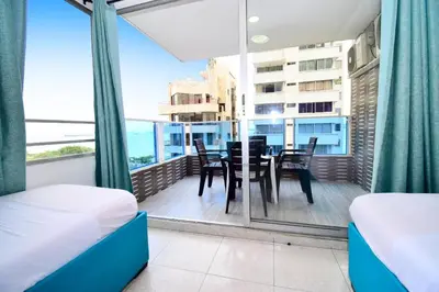 a room with a balcony with a table and chairs at apartamento con balcon p6 in Cartagena de Indias