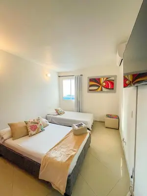 a bedroom with two beds and a window at Espectacular apartamento vista al mar in Cartagena de Indias