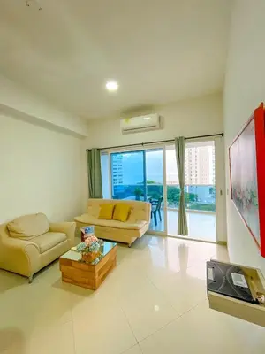 a living room with two couches and a large window at Espectacular apartamento vista al mar in Cartagena de Indias