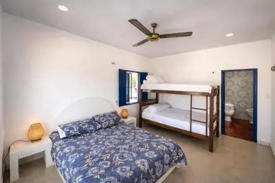 a bedroom with a bed and a bunk bed at Villa Liz in Puebloviejo