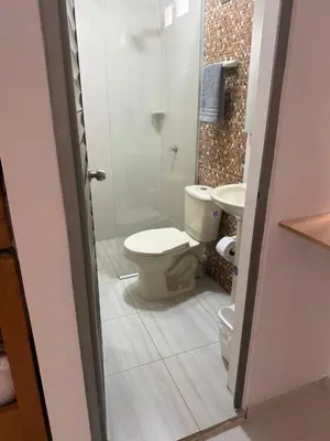 a bathroom with a toilet and a sink at Private pool cabin near the sea Puerto Velero in Tubará