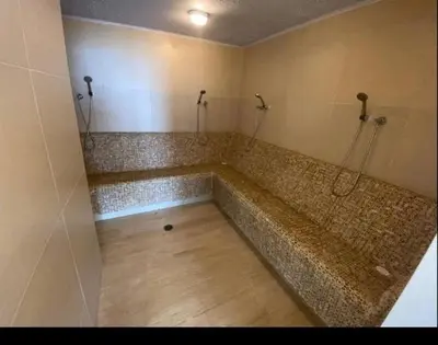 a bathroom with a large tub with a wooden floor at Cartagena Beach Resort in Cartagena de Indias