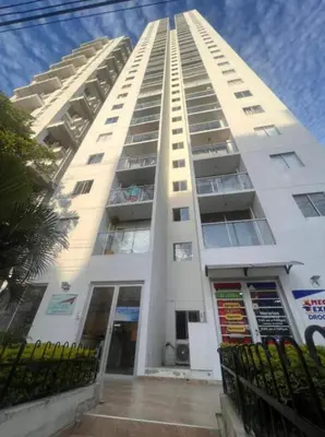 a tall white apartment building with a balcony at Alina Beautiful Cartagena Apartment in Cartagena de Indias