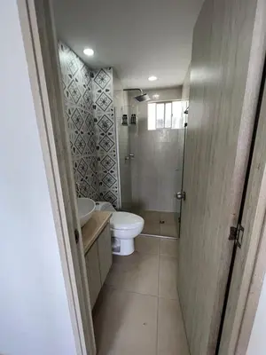 a bathroom with a toilet and a sink and a shower at Alina Beautiful Cartagena Apartment in Cartagena de Indias