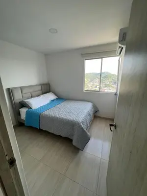 a small bedroom with a bed and a window at Alina Beautiful Cartagena Apartment in Cartagena de Indias