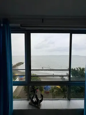 a view of the ocean from a room with a window at MnM Vacation Rentals in Cartagena de Indias