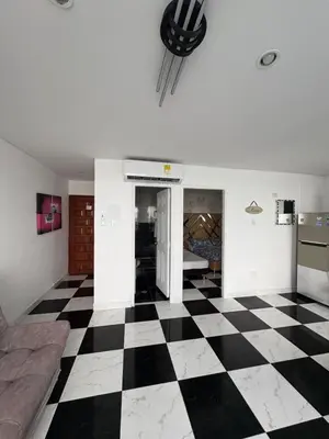 a living room with a black and white checkered floor at MnM Vacation Rentals in Cartagena de Indias