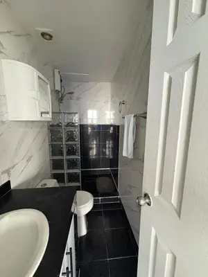 a bathroom with a sink and a toilet at MnM Vacation Rentals in Cartagena de Indias