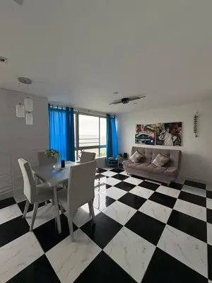 a living room with a checkered floor at MnM Vacation Rentals in Cartagena de Indias