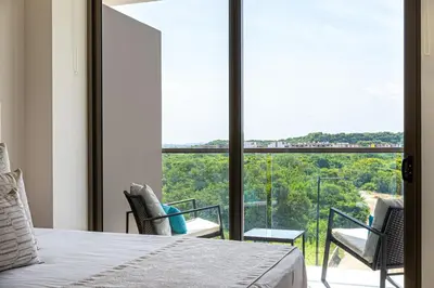 a bedroom with a bed and a large window at Exclusive 2BR en Morros Eos with Pool & Parking in Cartagena de Indias