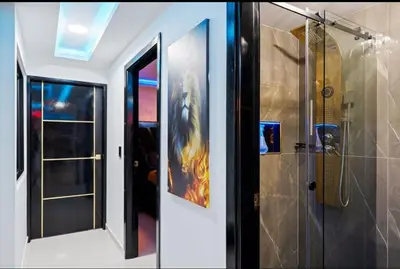 a bathroom with a shower and a glass door at Modern Luxury 2BR with Private Jacuzzi in Cartagena de Indias