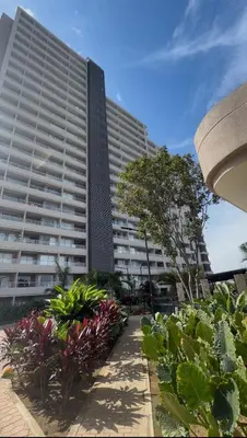 a large building with a lot of plants in front of it at All new apartment in Santa Marta - NR Stays in Santa Marta