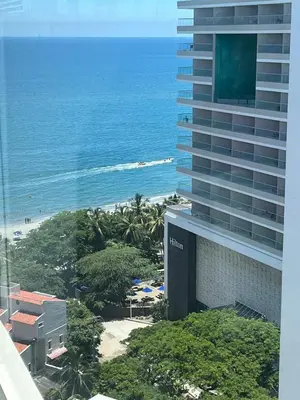 a view of the ocean from the balcony of a hotel at Apartaestudio con hotel y playa in Santa Marta