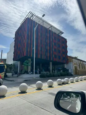 a large building with a red at Apartamento Altos de Montecristo in Barranquilla