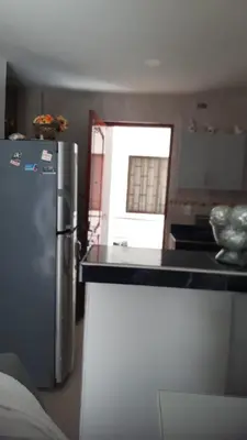 a kitchen with a refrigerator and a counter top at Apartamento Sector Torices in Cartagena de Indias