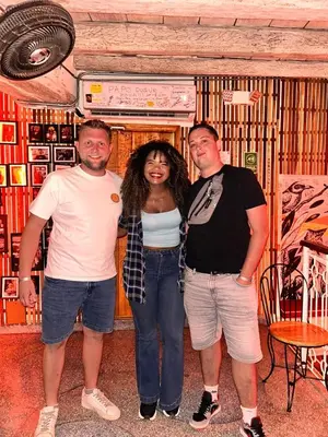 a group of three people standing in a room at Cartagena Rumbera in Cartagena de Indias