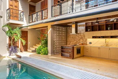 a kitchen and a swimming pool in a house at Casa Emilia - Luxury Villa in the Historic Center in Cartagena de Indias