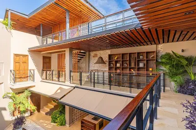an indoor balcony of a house with a staircase at Casa Emilia - Luxury Villa in the Historic Center in Cartagena de Indias